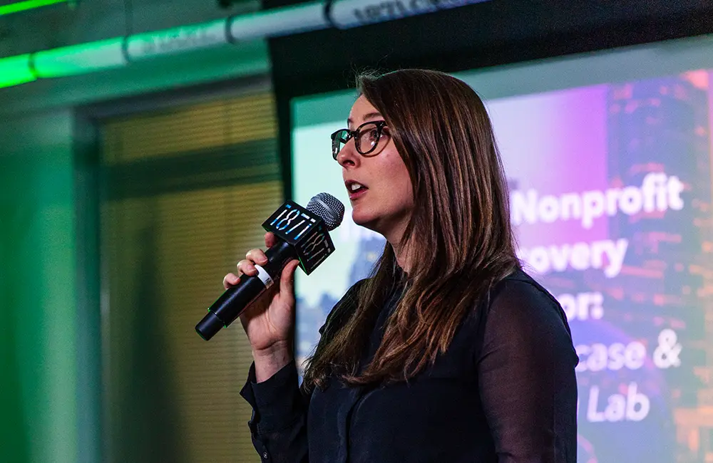 Woman speaking at 1871's Woman Tech Pitch Competition